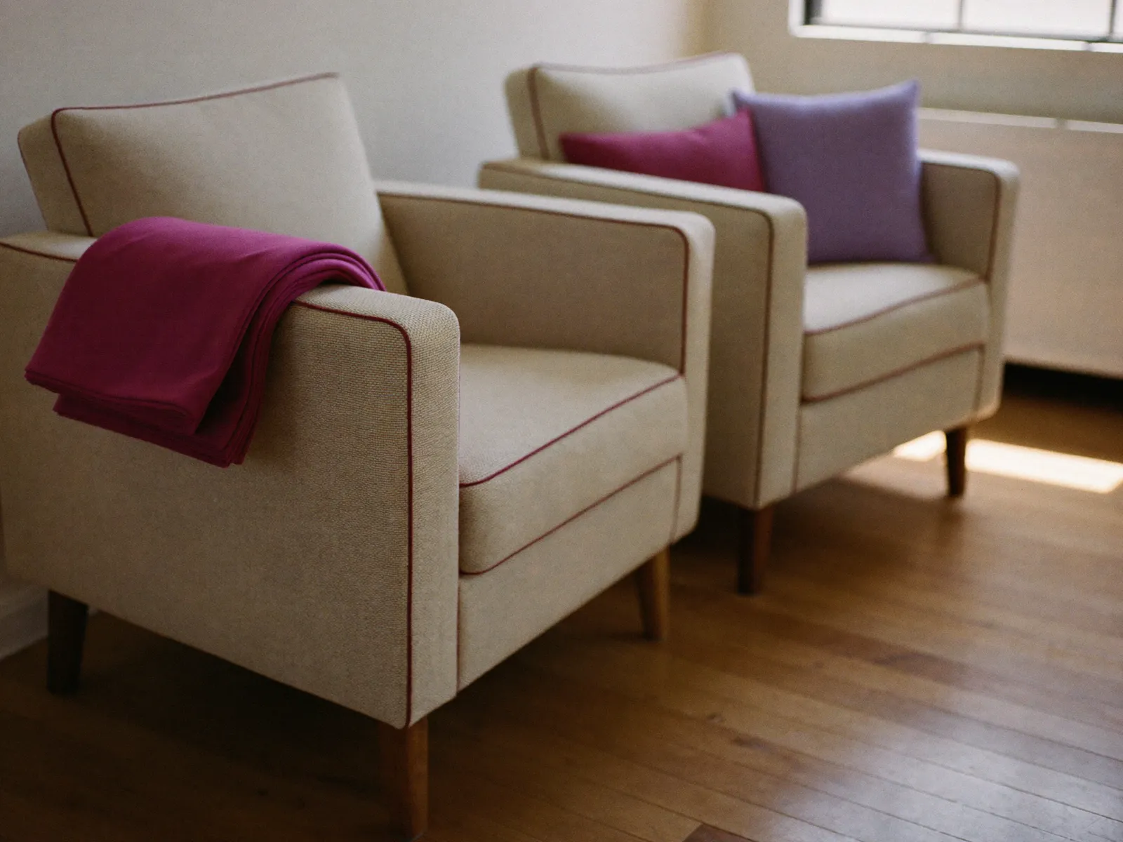 Two armchairs facing each other in a calm counselling room